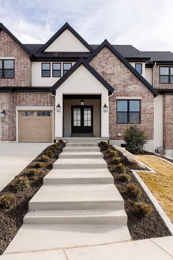 A house with a white door and steps leading to it.
