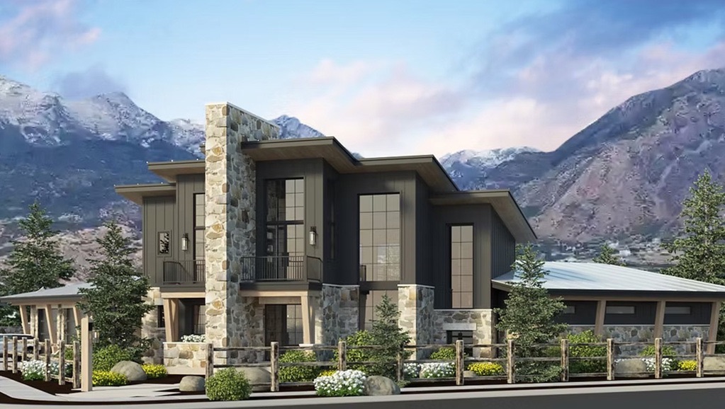 A house with mountains and trees behind it.
