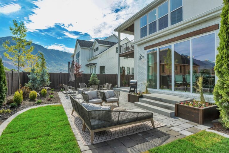 A house with a patio and mountains in background.